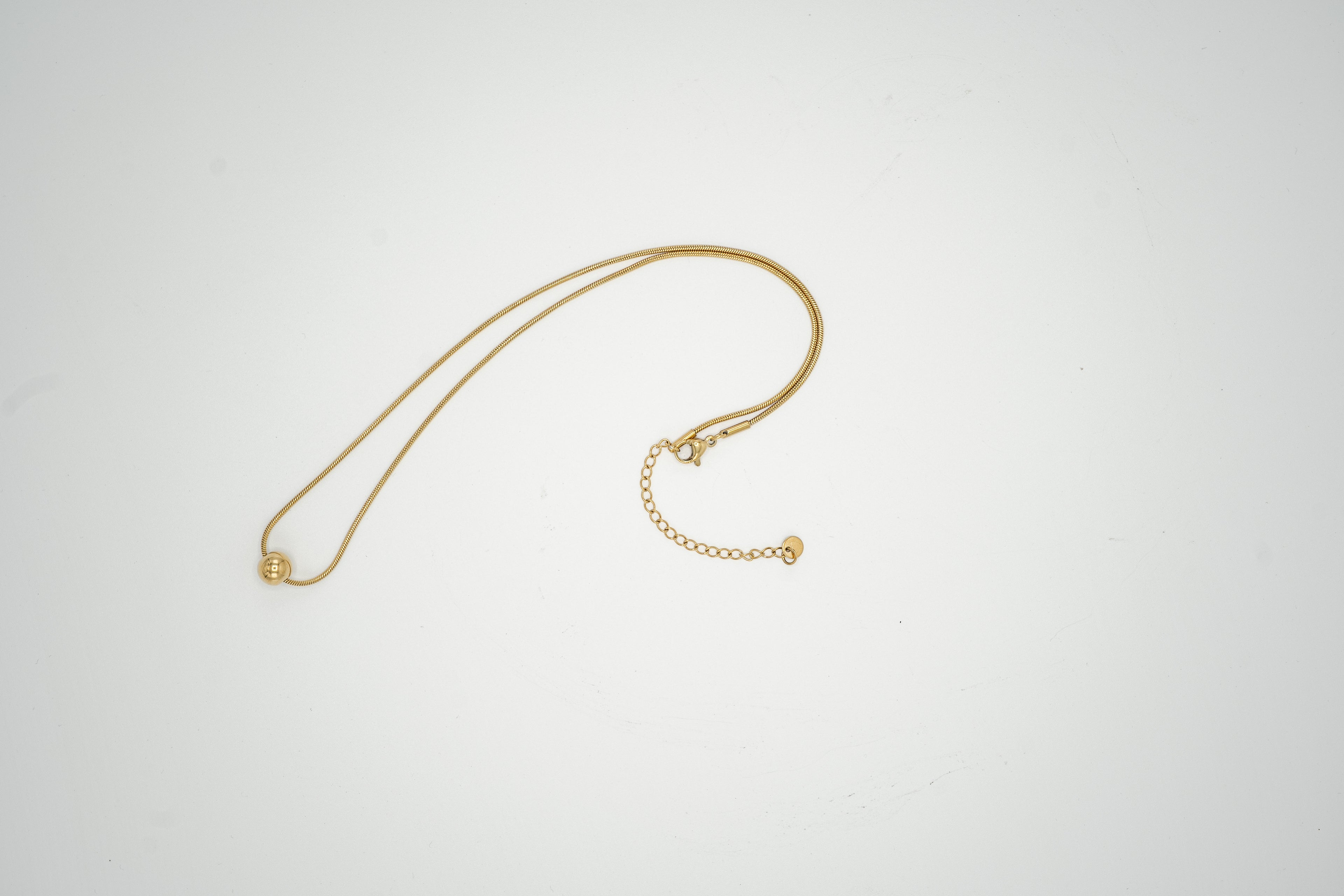 Golden Sphere Pendant Necklace